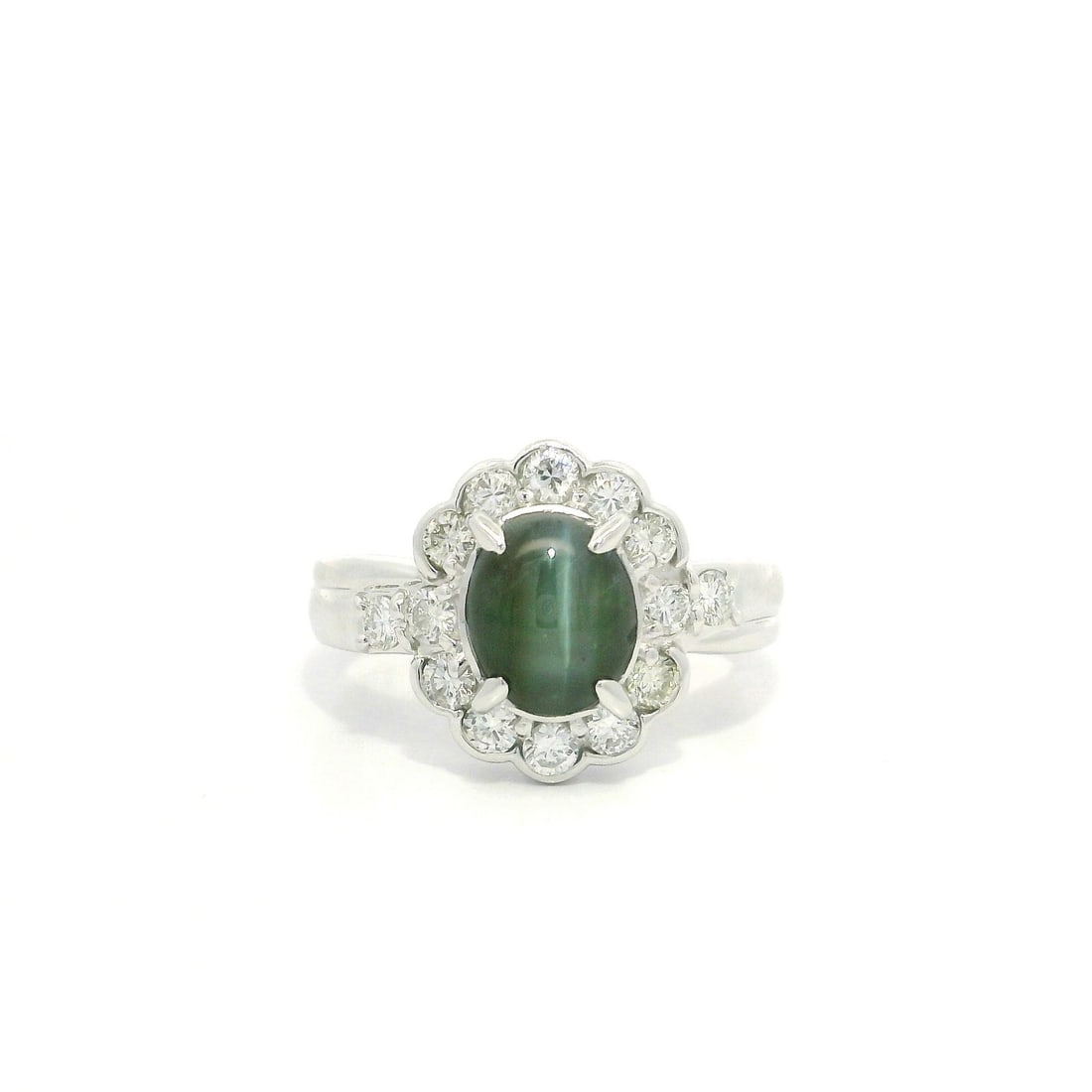 Platinum 3.07ctw Greenish Cat's Eye Ring with Diamond Halo: Platinum 3.07ctw Greenish Cat's Eye Ring with Diamond Halo Elevate your jewelry collection with this stunning Platinum Ring featuring a captivating 3.07 carat total weight. At its center, a natural ge