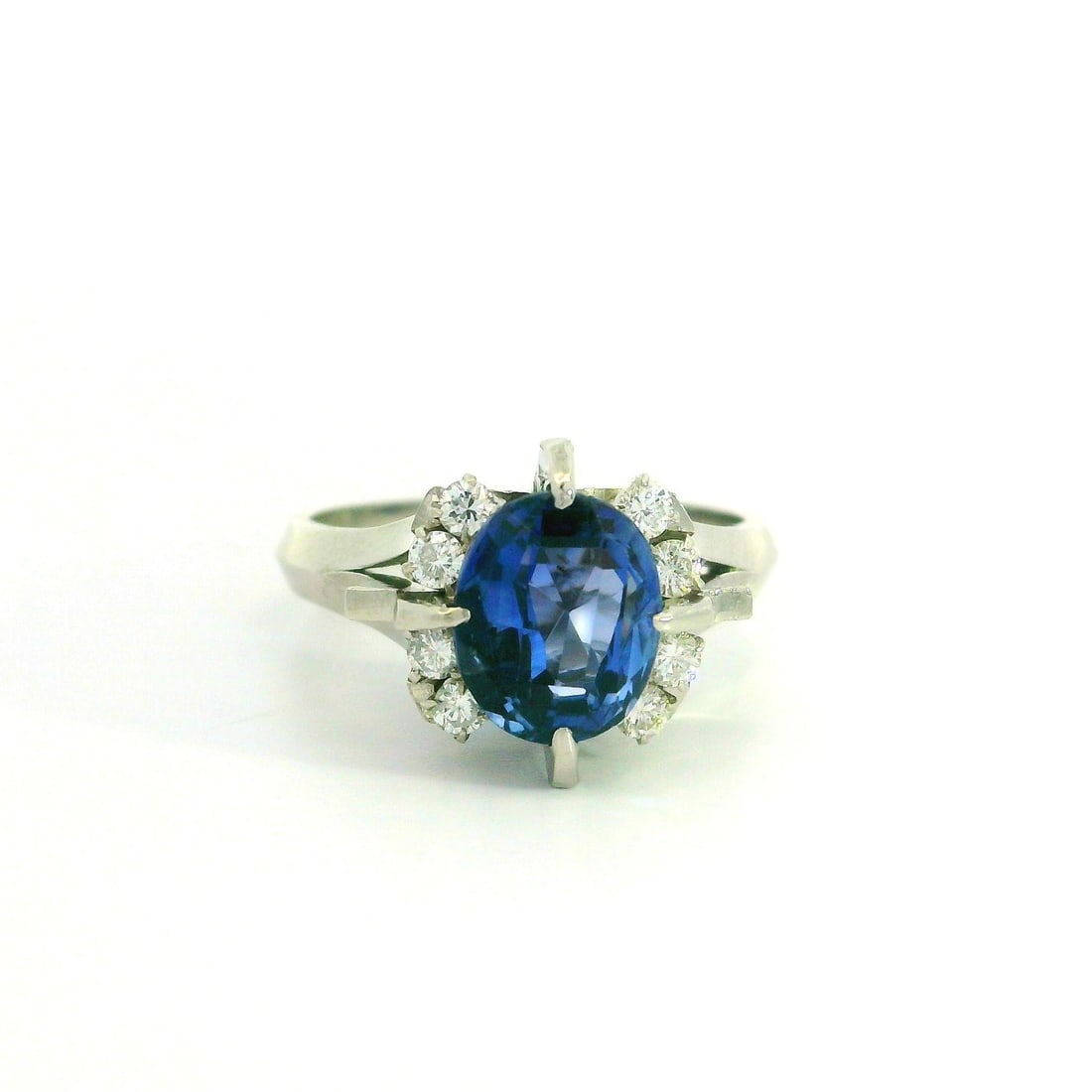 Platinum 2.48ctw Oval Cut Sapphire Diamond Accent Ring: Platinum 2.48ctw Oval Cut Sapphire Diamond Accent Ring This stunning cocktail ring features a high-set design with a captivating natural genuine sapphire at its center. The sapphire is an old oval cut