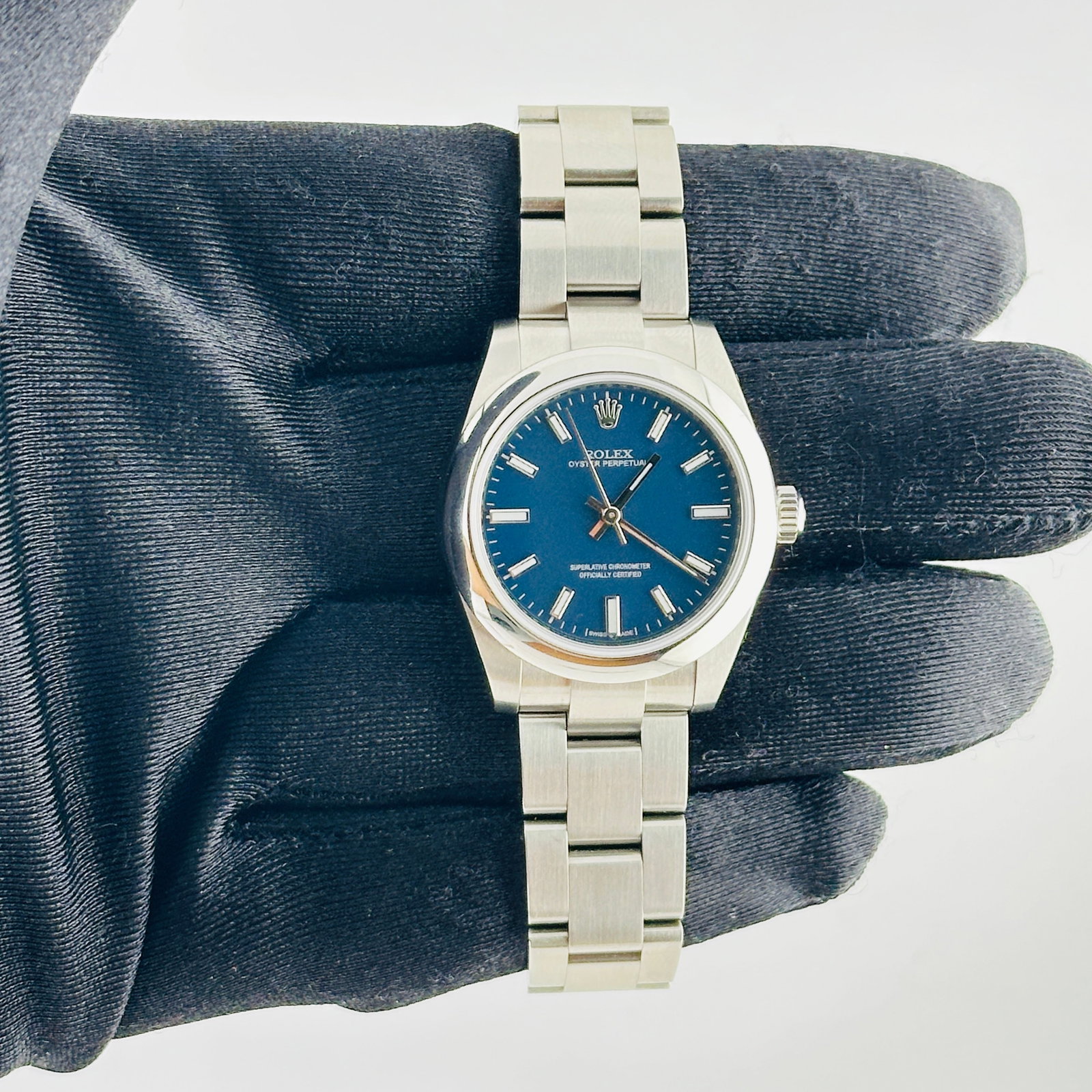 Rolex Ladies Oyster Perpetual Watch Blue Stick Dial Ref 177200: Rolex Ladies Oyster Perpetual Watch Blue Stick Dial Ref 177200 This Rolex Oyster Perpetual features a white dial, smooth bezel, and classic Oyster bracelet. Designed for ladies, it is identified by re