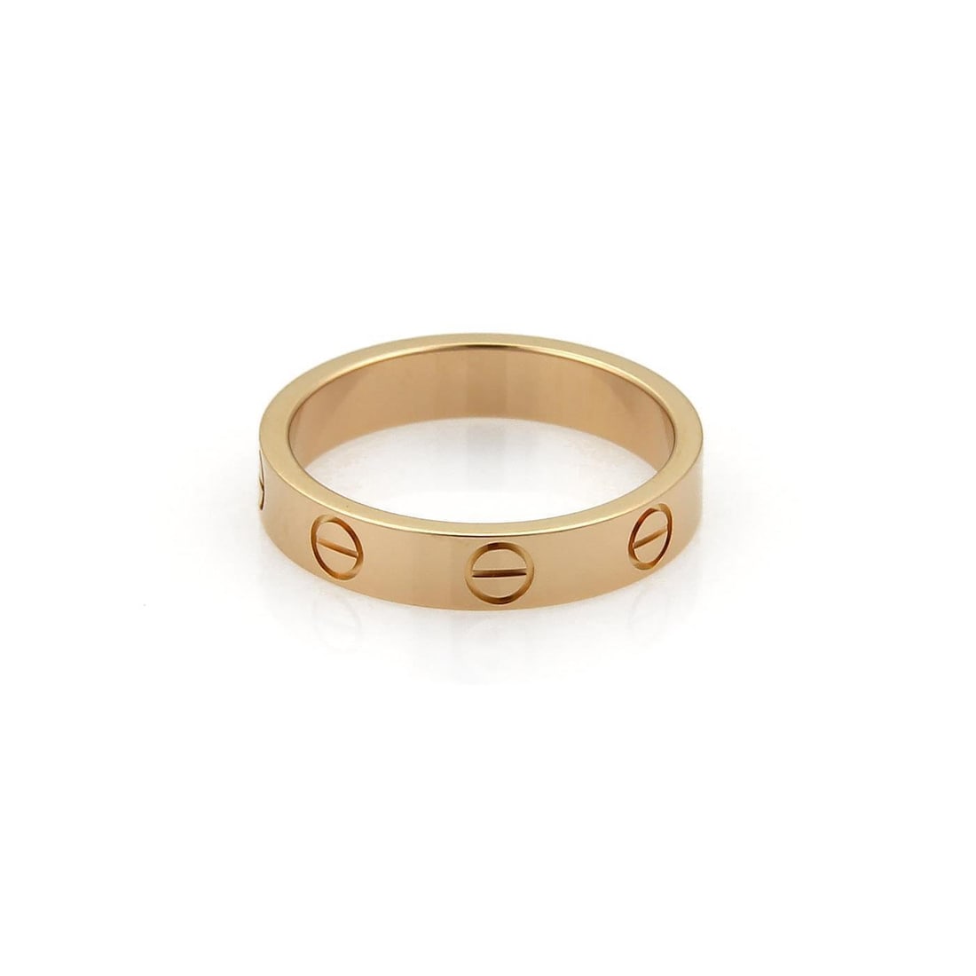 Cartier Mini Love 18k Pink Gold Band Ring US 5: Cartier Mini Love 18k Pink Gold Band Ring US 5 This exquisite band ring from Cartier's iconic LOVE collection is crafted from authentic 18k pink gold, showcasing a fine polished finish. The ring is de