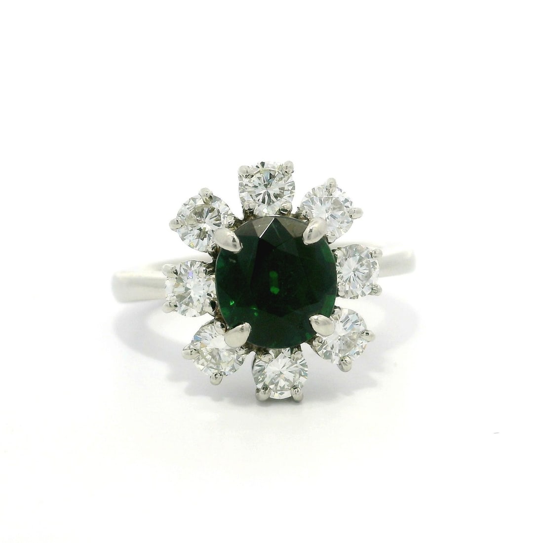 Platinum 3.21ctw GIA Tsavorite Diamond Halo Cocktail Ring: Platinum 3.21ctw GIA Tsavorite Diamond Halo Cocktail Ring This stunning cocktail ring showcases a high-quality 3.21 carat total weight of natural gemstones, featuring a vibrant oval-cut tsavorite at i