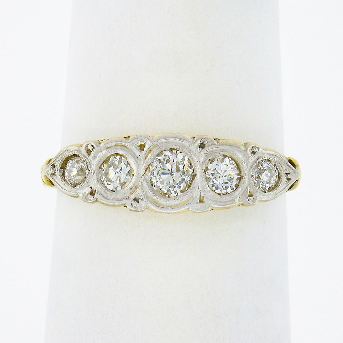 Antique 18K Gold Platinum 0.45ctw Diamond 5 Stone Filigree Band Ring: Antique 18K Gold Platinum 0.45ctw Diamond 5 Stone Filigree Band Ring This exquisite antique band ring features a stunning design crafted from solid 18K yellow gold with a platinum top, dating back to 