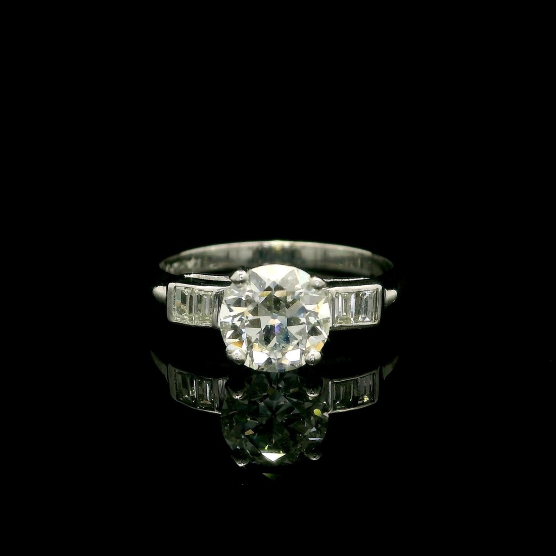 Vintage Platinum GIA Certified 1.29ctw Diamond Engagement Ring: Vintage Platinum GIA Certified 1.29ctw Diamond Engagement Ring This vintage engagement ring showcases a stunning design crafted from solid platinum, featuring a central natural diamond of 1.14ct in a 