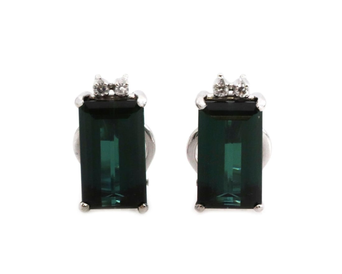 Elegant 18k White Gold Tourmaline Diamond Huggie Earrings: Elegant 18k White Gold Tourmaline Diamond Huggie Earrings This exquisite pair of huggie earrings is meticulously crafted from 18k white gold, showcasing a striking emerald cut green tourmaline gemston