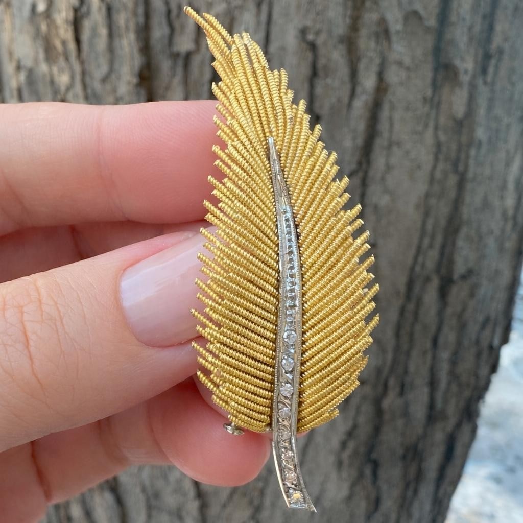 Feather Motif 18k Gold Brooch with Single Cut Diamonds Vintage Pin: Feather Motif 18k Gold Brooch with Single Cut Diamonds Vintage Pin This vintage feather pin brooch is crafted from solid 18k yellow gold with contrasting white gold accents. It features eight natural 