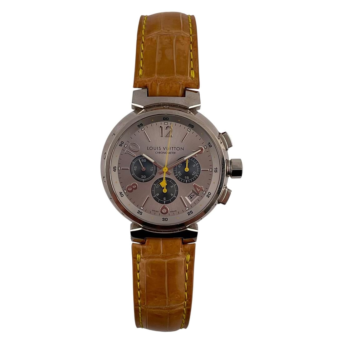 Tambour Slate Grey Dial Q11430 Watch with Leather Strap by Louis Vuitton: Tambour Slate Grey Dial Q11430 Watch with Leather Strap by Louis Vuitton This Louis Vuitton Tambour wristwatch features a slate grey dial and comes with a leather strap. Designed as a unisex accessory