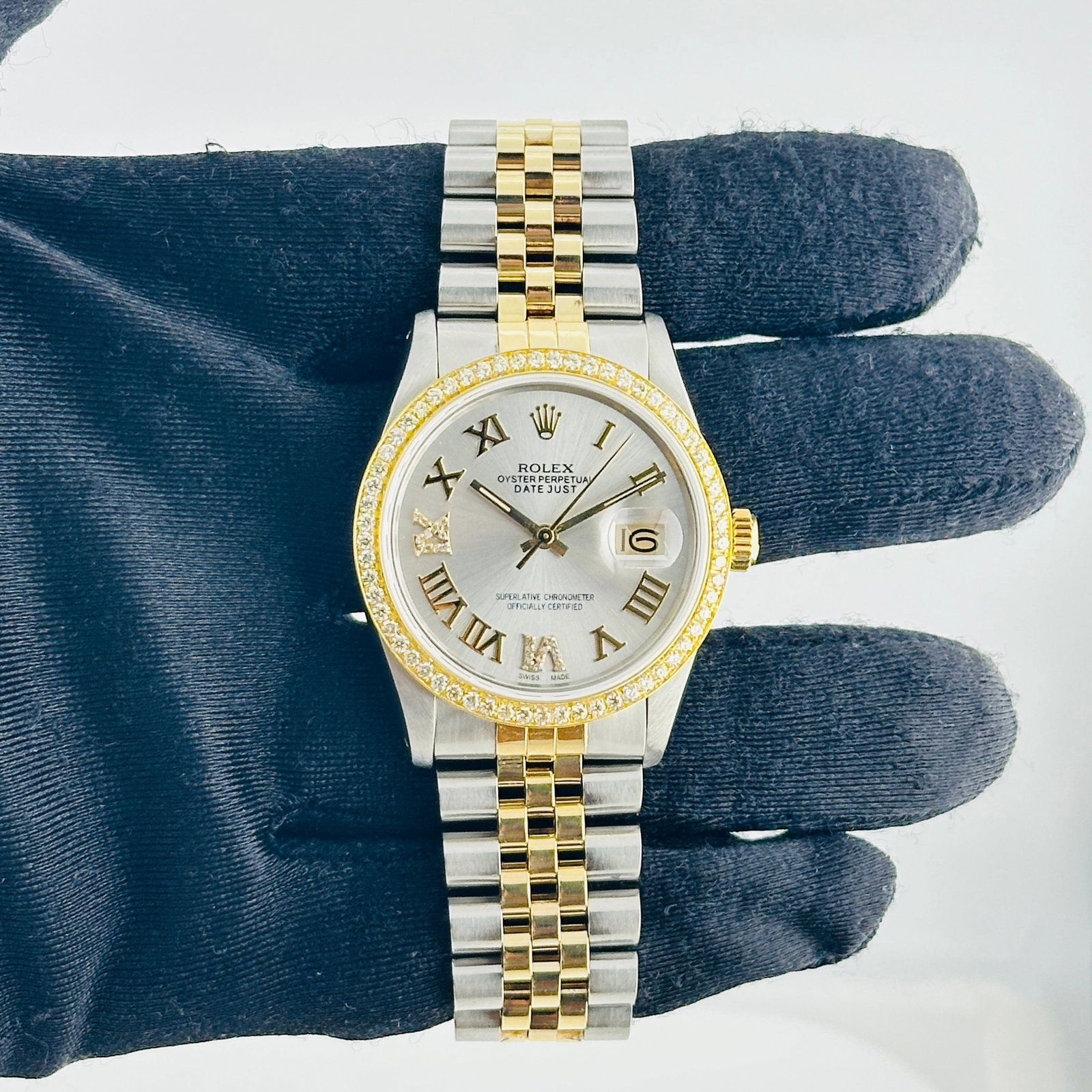 Rolex Datejust Ref 16013 Mens Watch with aftermarket diamond dial bracelet: Rolex Datejust Ref 16013 Mens Watch with aftermarket diamond dial bracelet Rolex Datejust men's watch, reference 16013, with an Aftermarket silver Roman 6 & 9 diamond dial, pave 10K diamond bezel, and