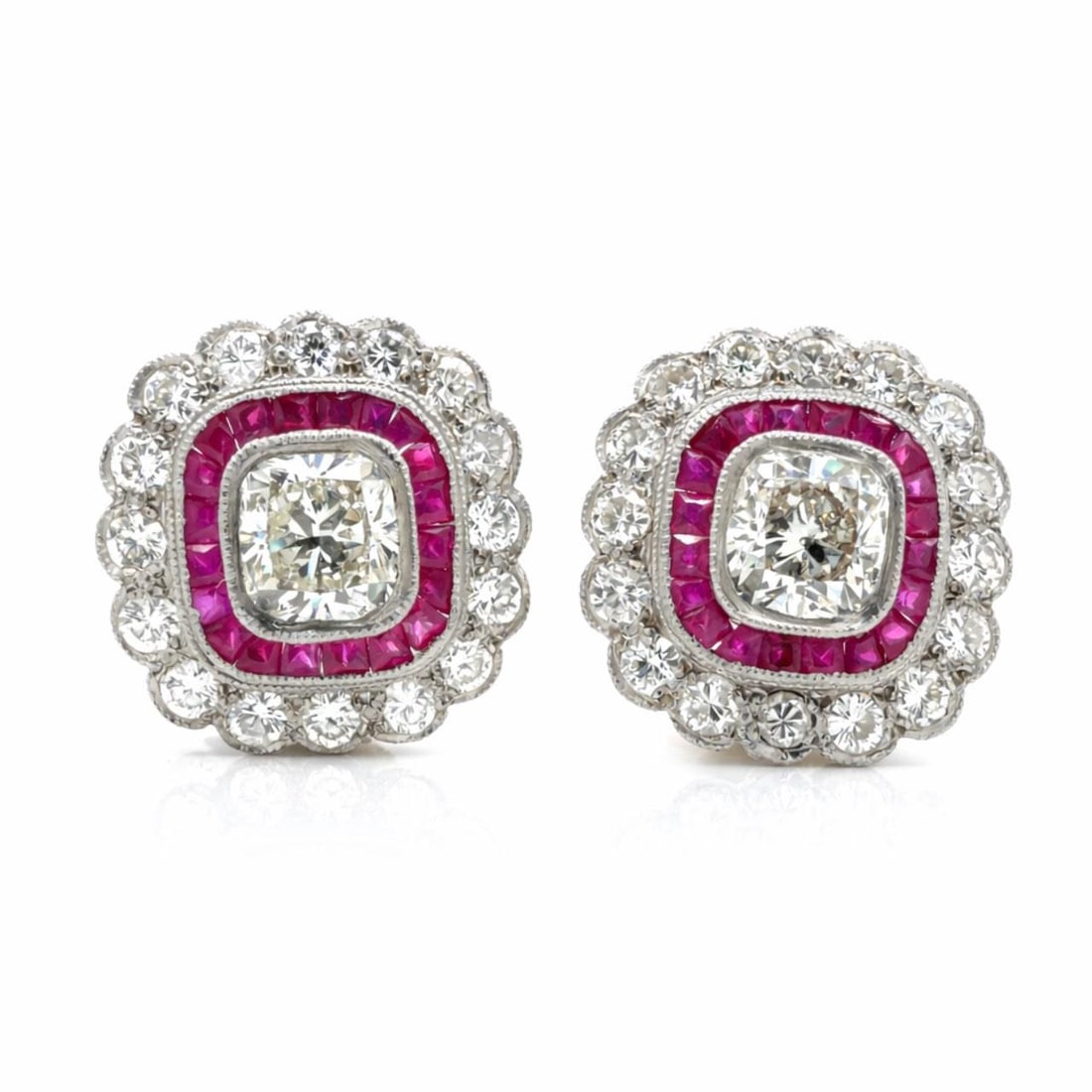 Diamond Ruby Earrings in Platinum and 18K White Gold 0.75 Inch Length: Diamond Ruby Earrings in Platinum and 18K White Gold 0.75 Inch Length These earrings are crafted from platinum and 18K white gold, featuring two cushion-cut diamonds totaling approximately 2.80 carats