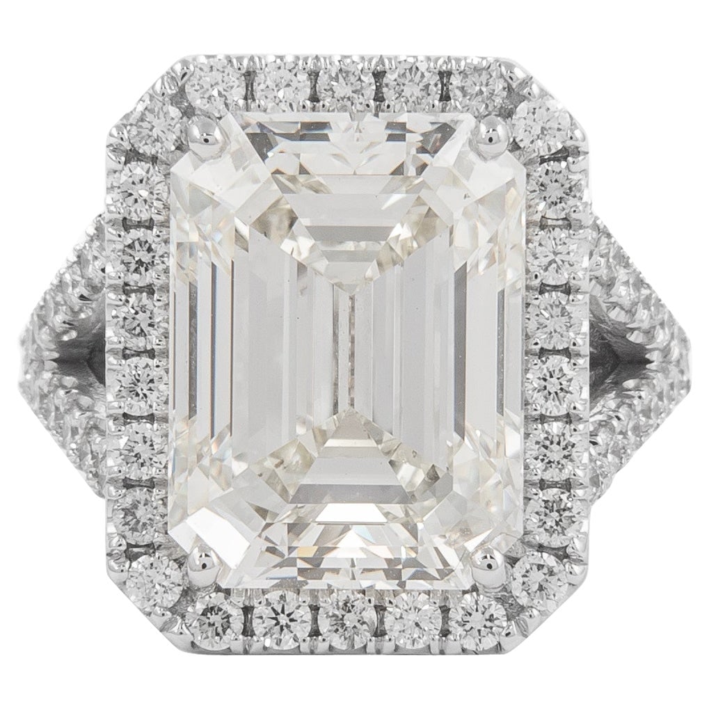 10.01ct Emerald Cut Diamond Halo Ring in 18k White Gold GIA Certified: 10.01ct Emerald Cut Diamond Halo Ring in 18k White Gold GIA Certified This exquisite engagement ring features a stunning 10.01 carat emerald cut diamond, GIA certified with a J color grade and VS2 cla