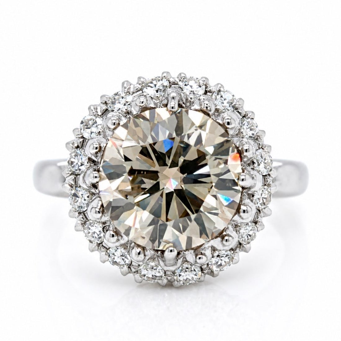 IGI Certified 4.89 Ct Light Brown Diamond Ring in 14K White Gold: IGI Certified 4.89 Ct Light Brown Diamond Ring in 14K White Gold Vintage 1950's diamond ring crafted in 14K white gold, featuring an IGI certified 4.89 ct round light brown diamond accented by 16 addi