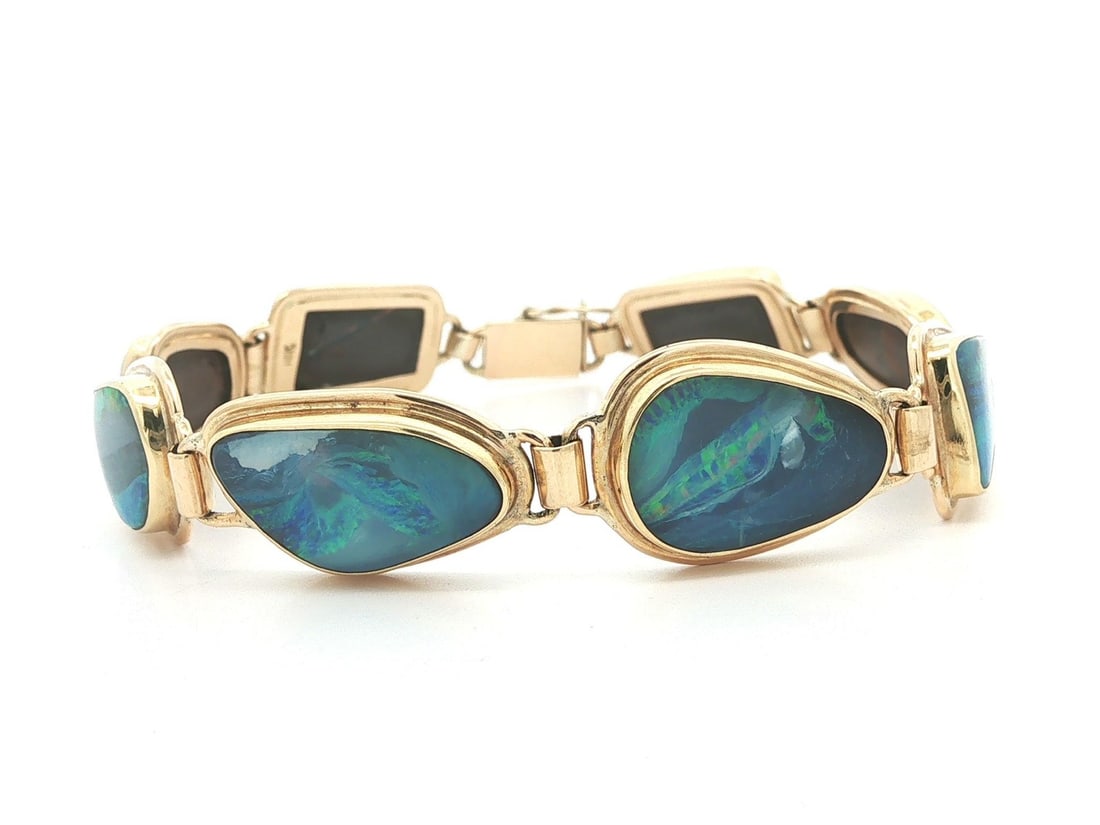 Unbranded 14K Yellow Gold Opal Link Bracelet Bezel Set Push Clasp: Unbranded 14K Yellow Gold Opal Link Bracelet Bezel Set Push Clasp This pre-owned bracelet features eight natural genuine freeform boulder opals bezel set in solid 14k yellow gold. It is a custom link 