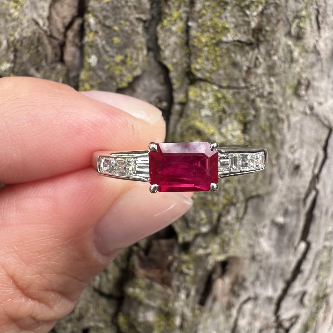 Platinum Cocktail Ring with GIA Burma Ruby and Baguette Diamonds 1.71ctw: Platinum Cocktail Ring with GIA Burma Ruby and Baguette Diamonds 1.71ctw Pre-owned women's cocktail ring featuring a natural vivid red Burma ruby in an emerald cut, accented by six baguette diamonds. 