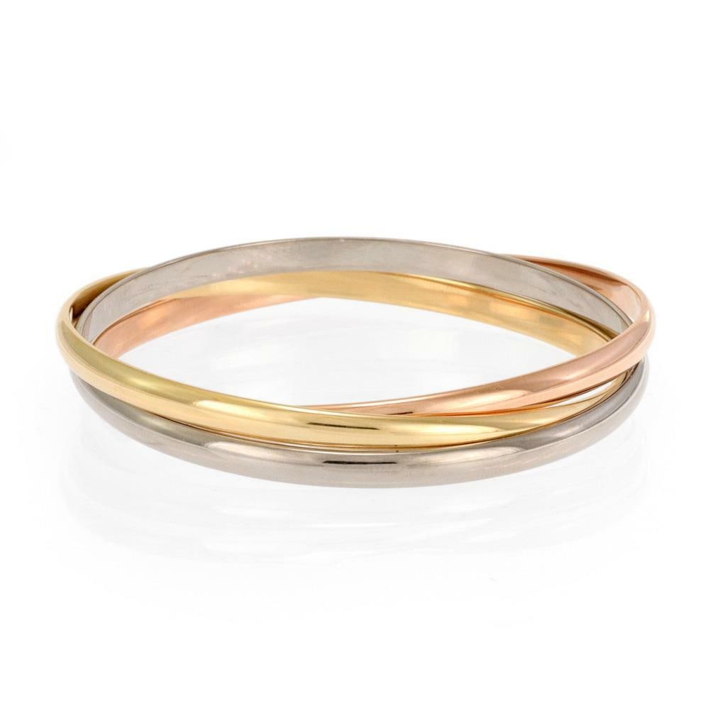 Cartier Trinity 18k Tricolor Gold Triple Rolling Bangle with Paper: Cartier Trinity 18k Tricolor Gold Triple Rolling Bangle with Paper Introducing a stunning piece from Cartier's prestigious Trinity Collection, this authentic triple rolling bangle is crafted from luxu
