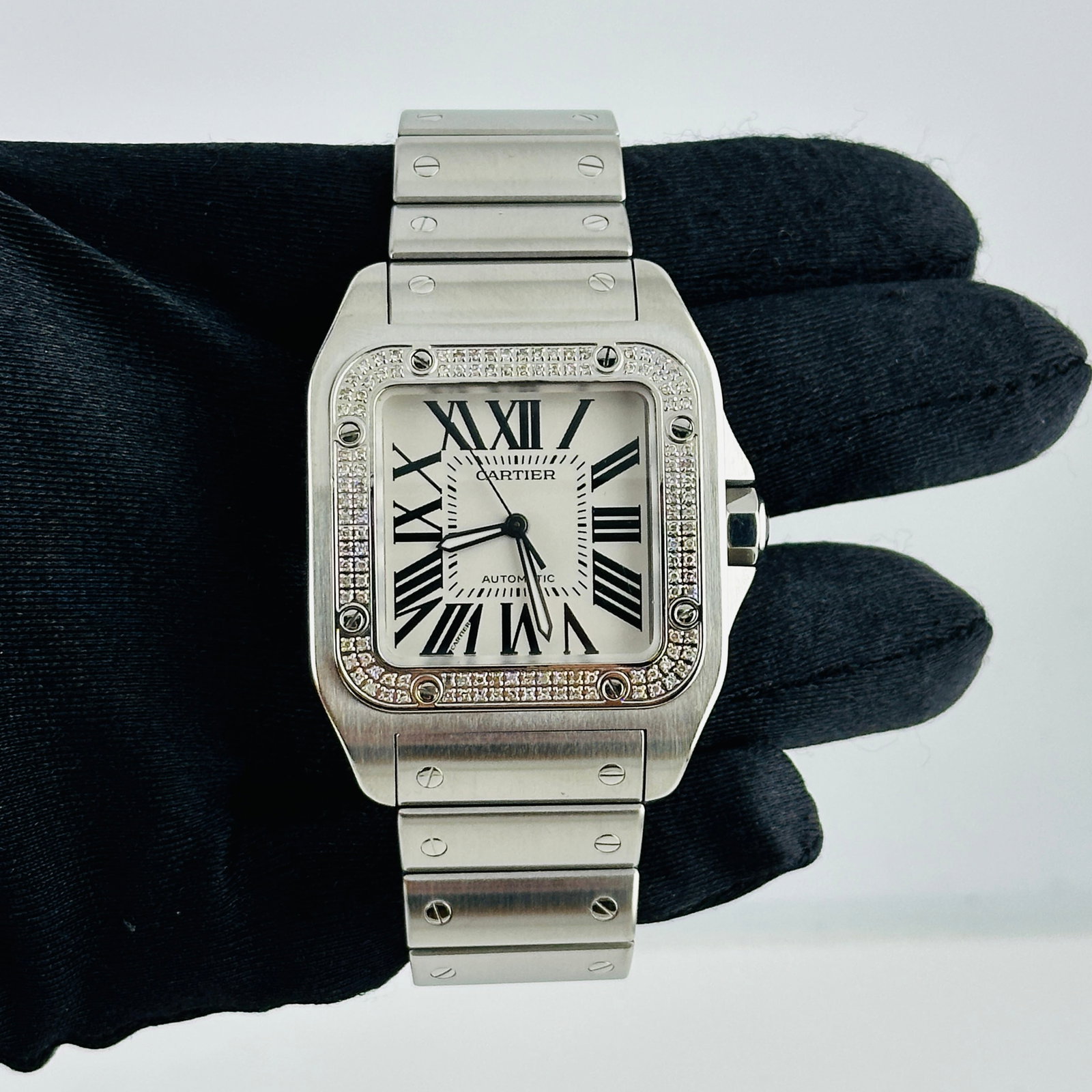 Cartier Santos 100 XL 38mm Watch White Roman Dial Stainless Steel Ref 2656: Cartier Santos 100 XL 38mm Watch White Roman Dial Stainless Steel Ref 2656 The Cartier Santos 100 XL features a white Roman dial, a diamond bezel, and a stainless steel bracelet. This men's watch is p