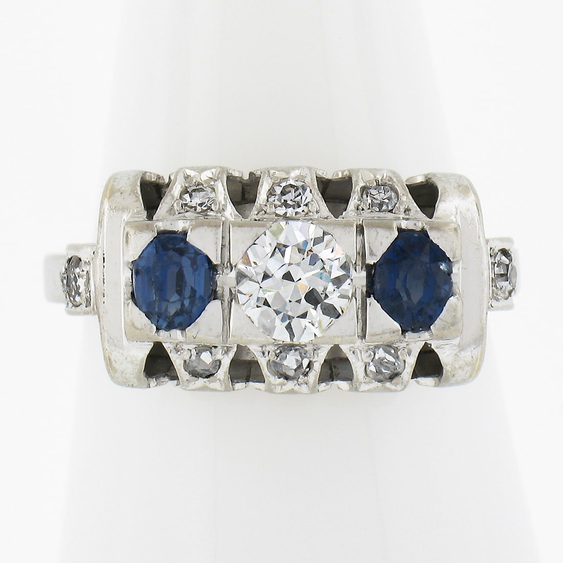 Antique 18k White Gold Sapphire Diamond Ring Band 0.59ctw: Antique 18k White Gold Sapphire Diamond Ring Band 0.59ctw This exquisite antique ring features a stunning combination of old cut sapphires and diamonds set in solid 18k white gold. The ring showcases 