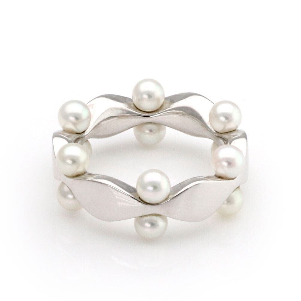 Mikimoto Akoya Pearl Fancy Band Ring in 18k White Gold Size 4: Mikimoto Akoya Pearl Fancy Band Ring in 18k White Gold Size 4 Authentic Mikimoto Akoya pearl fancy band ring crafted in 18k white gold. This sculptural band features a graceful arrangement of cultured