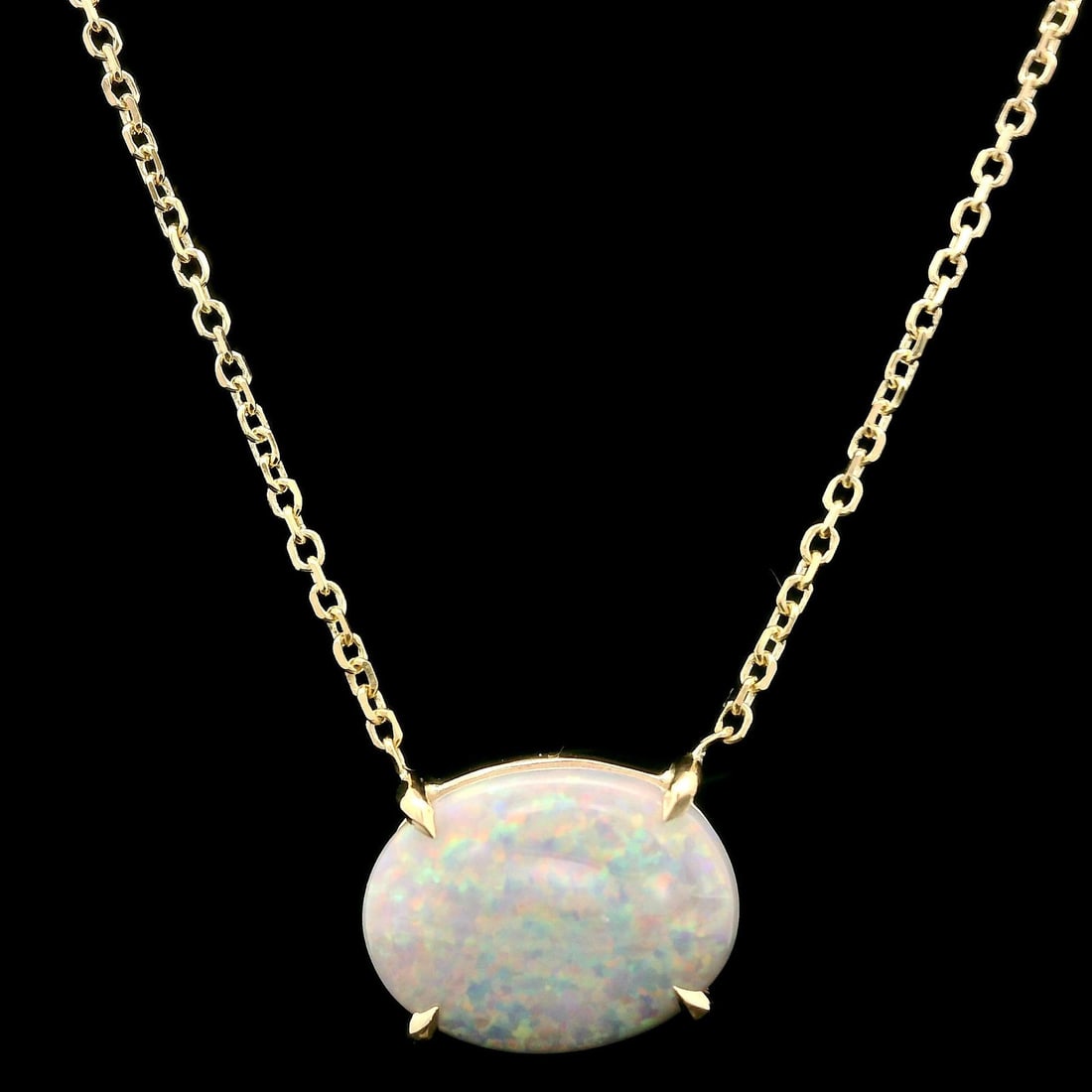 14k Yellow Gold 1.13ct Gray Opal East West Pendant Necklace: 14k Yellow Gold 1.13ct Gray Opal East West Pendant Necklace This exquisite pendant necklace features a stunning natural gray opal, showcasing a mesmerizing play of green, orange, and violet hues. The 