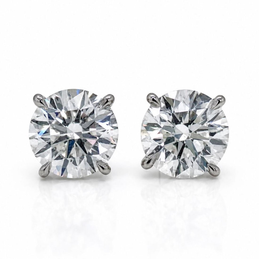 GIA Certified 14K White Gold Diamond Stud Earrings 3.03 Ct: GIA Certified 14K White Gold Diamond Stud Earrings 3.03 Ct 14K white gold diamond stud earrings featuring two round diamonds with a combined total weight of 3.03 ct. The earrings are GIA certified and