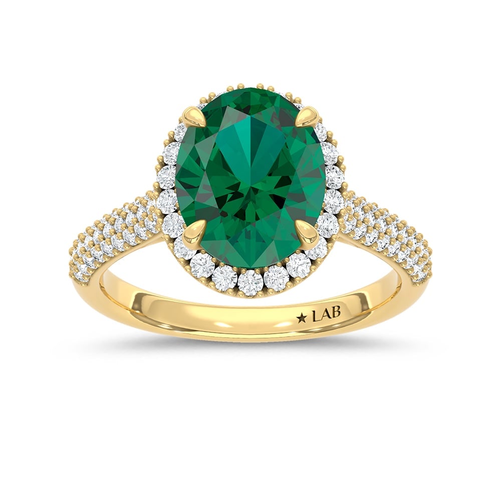 14K Yellow Gold Lab Grown Diamond 3 1/3 Ct.Tw. Oval Shape Recrystalized Emerald Engagement Ring: 14K Yellow Gold Lab Grown Diamond 3 1/3 Ct.Tw. Oval Shape Recrystalized Emerald Engagement Ring (Center 2 3/4 ct) 14k Yellow Gold Stone Color: D-f Stone Clarity: Vs Each ring is presented in standard 