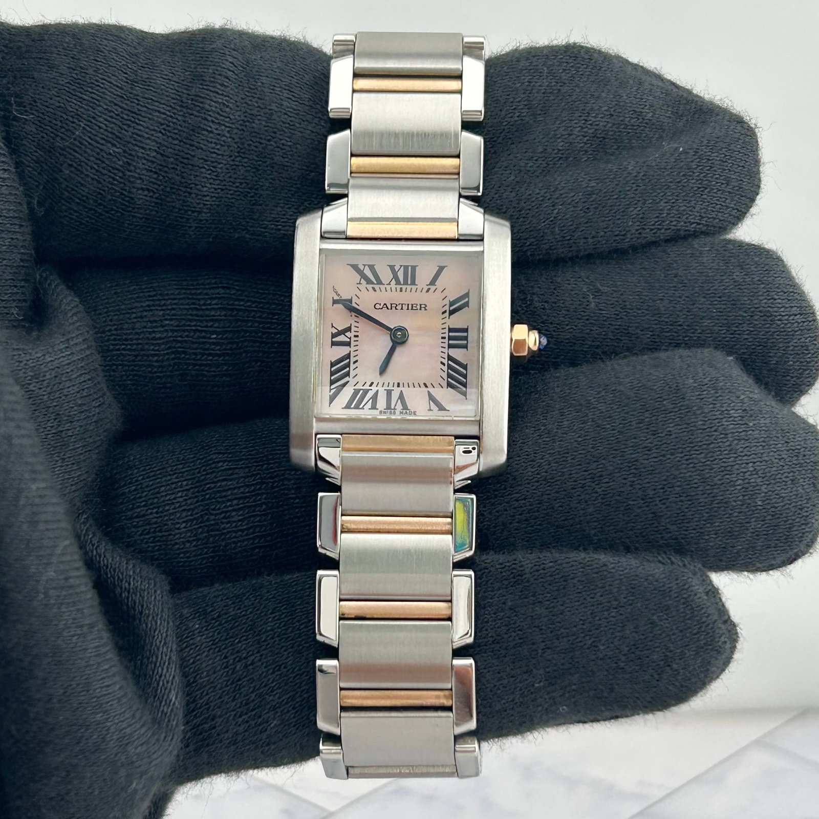 Cartier W51007Q4 Tank Francaise Ladies Watch Pink MOP Dial Steel Bracelet: Cartier W51007Q4 Tank Francaise Ladies Watch Pink MOP Dial Steel Bracelet Cartier Tank Francaise ladies wristwatch featuring a pink mother-of-pearl dial with Roman numerals, a smooth bezel, and a stai