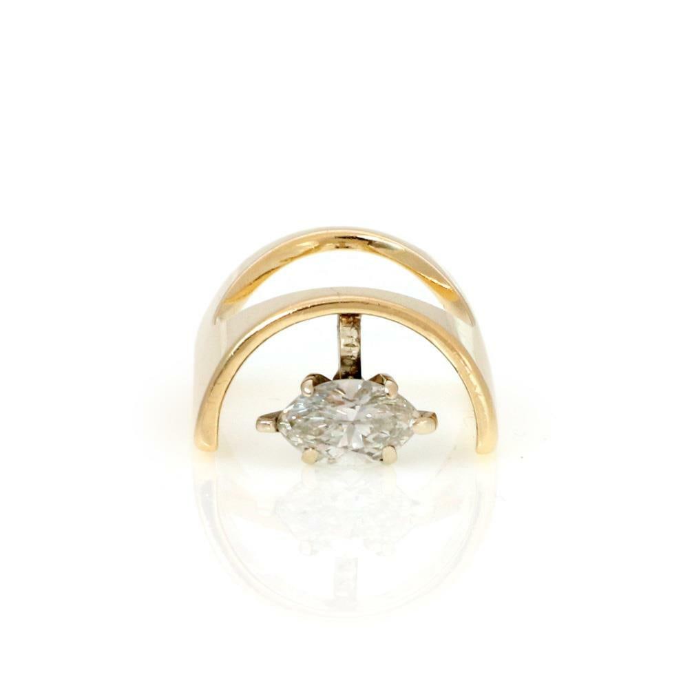 Unique Vintage 14k Yellow Gold Marquise Diamond Ring Size 4: Unique Vintage 14k Yellow Gold Marquise Diamond Ring Size 4 Discover a unique vintage ring crafted from 14k yellow gold, featuring a distinctive long half-barrel design. The ring showcases a beautiful