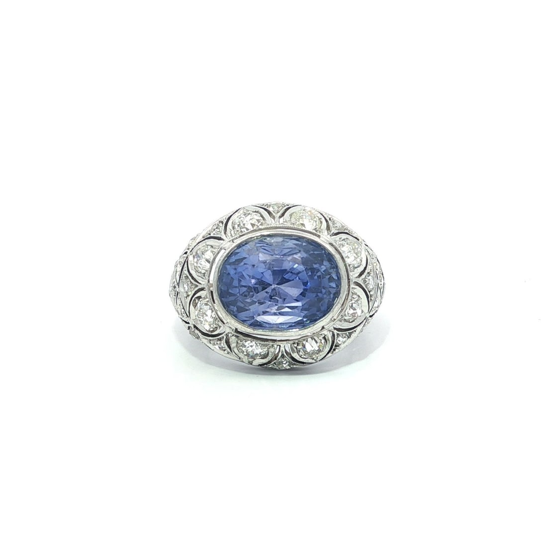Edwardian Era White Gold Sapphire and Diamond Ring GIA Certified Color Change: Edwardian Era White Gold Sapphire and Diamond Ring GIA Certified Color Change This antique Edwardian ring features a natural oval-cut sapphire, bezel set in solid 18k white gold. The sapphire displays