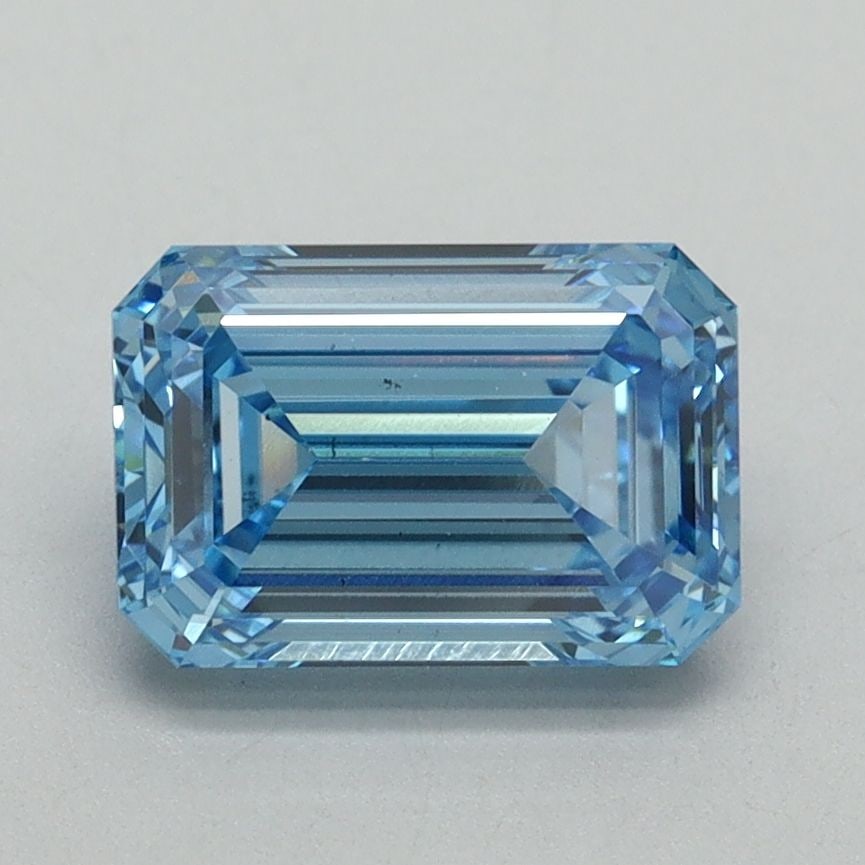 Loose Diamond - EMERALD 1.71ct Fancy Vivid Blue VS2: Loose Diamond - EMERALD 1.71ct Fancy Vivid Blue VS2 Source: This is a real non-mined Diamond that has been grown in a lab Shape: EMERALD Carats: 1.71 Color: Fancy Vivid Blue Certification: IGI Video: