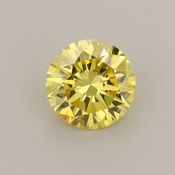Loose Diamond - ROUND 0.53ct Fancy Vivid Yellow VS2: Loose Diamond - ROUND 0.53ct Fancy Vivid Yellow VS2 Source: This is a real non-mined Diamond that has been grown in a lab Shape: ROUND Carats: 0.53 Color: Fancy Vivid Yellow Certification: IGI Video: