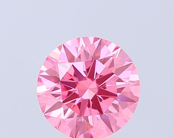 Ideal Loose Diamond - ROUND 1.05ct Fancy Vivid Pink VS1: Ideal Loose Diamond - ROUND 1.05ct Fancy Vivid Pink VS1 Source: This is a real non-mined Diamond that has been grown in a lab Shape: ROUND Carats: 1.05 Color: Fancy Vivid Pink Certification: IGI Video