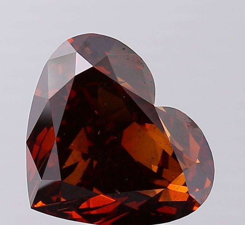 Loose Diamond - HEART 5.02ct Fancy Deep Brownish Orange SI1: Loose Diamond - HEART 5.02ct Fancy Deep Brownish Orange SI1 Source: This is a real non-mined Diamond that has been grown in a lab Shape: HEART Carats: 5.02 Color: Fancy Deep Brownish Orange