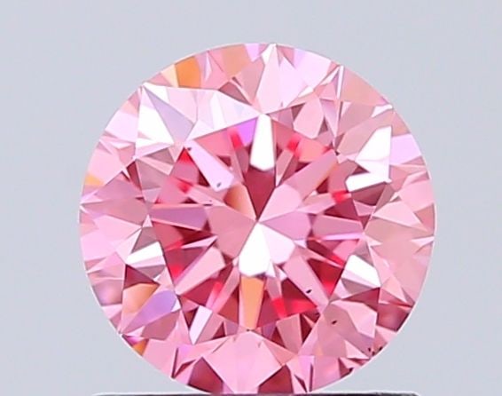 Ideal Loose Diamond - ROUND 1.08ct Fancy Vivid Pink VS2: Ideal Loose Diamond - ROUND 1.08ct Fancy Vivid Pink VS2 Source: This is a real non-mined Diamond that has been grown in a lab Shape: ROUND Carats: 1.08 Color: Fancy Vivid Pink Certification: IGI Video