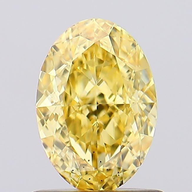Loose Diamond - OVAL 1.02ct Fancy Vivid Yellow VS2: Loose Diamond - OVAL 1.02ct Fancy Vivid Yellow VS2 Source: This is a real non-mined Diamond that has been grown in a lab Shape: OVAL Carats: 1.02 Color: Fancy Vivid Yellow Certification: IGI Video:
