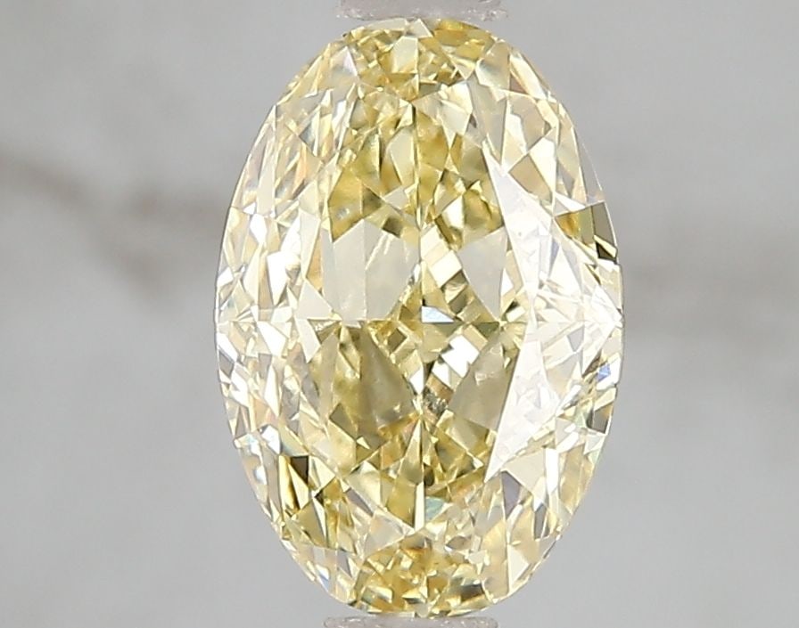 Loose Diamond - OVAL 2.1ct Fancy Intense Yellow VS2: Loose Diamond - OVAL 2.1ct Fancy Intense Yellow VS2 Source: This is a real non-mined Diamond that has been grown in a lab Shape: OVAL Carats: 2.1 Color: Fancy Intense Yellow Certification: IGI Video: