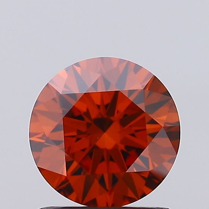 Ideal Loose Diamond - ROUND 1.1ct Fancy Vivid Orange VS1: Ideal Loose Diamond - ROUND 1.1ct Fancy Vivid Orange VS1 Source: This is a real non-mined Diamond that has been grown in a lab Shape: ROUND Carats: 1.1 Color: Fancy Vivid Orange Certification: IGI Vid