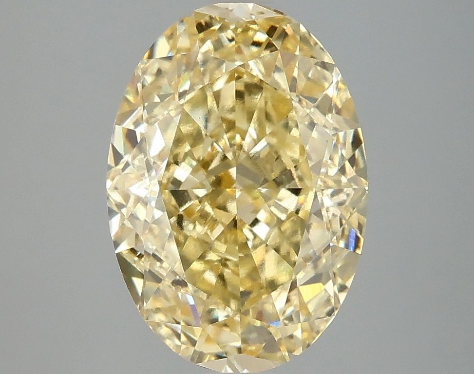 Loose Diamond - OVAL 4.01ct Fancy Vivid Yellow VVS2: Loose Diamond - OVAL 4.01ct Fancy Vivid Yellow VVS2 Source: This is a real non-mined Diamond that has been grown in a lab Shape: OVAL Carats: 4.01 Color: Fancy Vivid Yellow Certification: IGI Video: