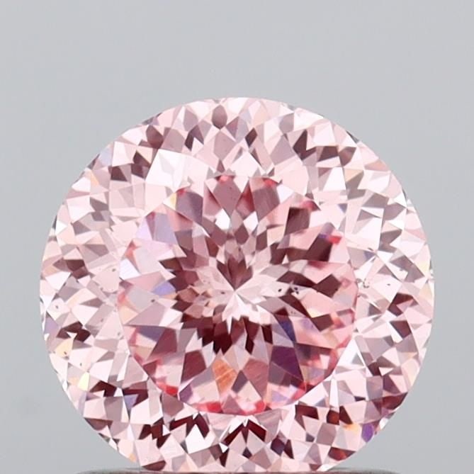 Loose Diamond - ROUND 1.06ct Fancy Vivid Pink VS2: Loose Diamond - ROUND 1.06ct Fancy Vivid Pink VS2 Source: This is a real non-mined Diamond that has been grown in a lab Shape: ROUND Carats: 1.06 Color: Fancy Vivid Pink Certification: IGI Video: