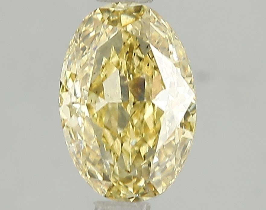 Loose Diamond - OVAL 1.72ct Fancy Intense Yellow SI1: Loose Diamond - OVAL 1.72ct Fancy Intense Yellow SI1 Source: This is a real non-mined Diamond that has been grown in a lab Shape: OVAL Carats: 1.72 Color: Fancy Intense Yellow Certification: IGI Video