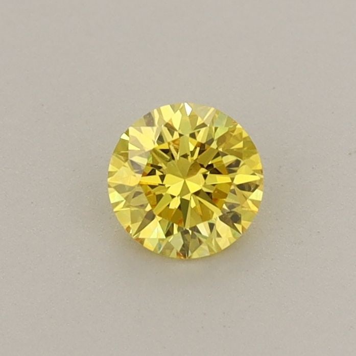 Loose Diamond - ROUND 0.3ct Fancy Vivid Yellow VVS2: Loose Diamond - ROUND 0.3ct Fancy Vivid Yellow VVS2 Source: This is a real non-mined Diamond that has been grown in a lab Shape: ROUND Carats: 0.3 Color: Fancy Vivid Yellow Certification: IGI Video: