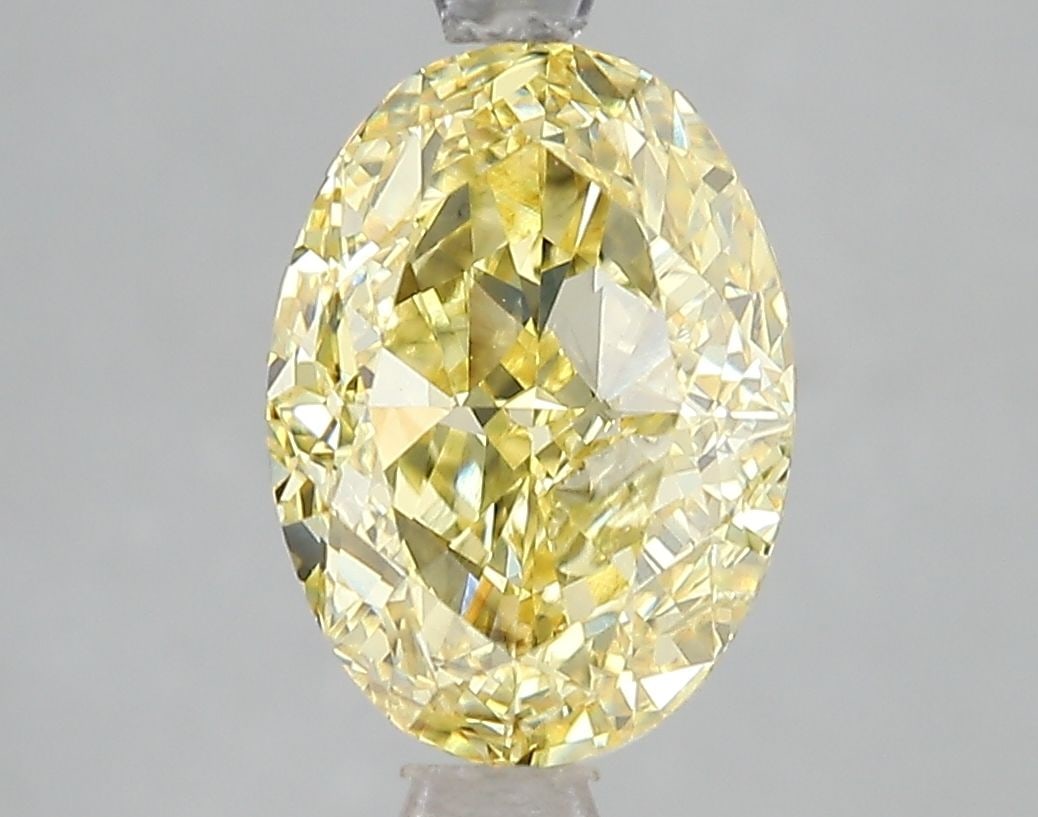 Loose Diamond - OVAL 3.04ct Fancy Vivid Yellow SI1: Loose Diamond - OVAL 3.04ct Fancy Vivid Yellow SI1 Source: This is a real non-mined Diamond that has been grown in a lab Shape: OVAL Carats: 3.04 Color: Fancy Vivid Yellow Certification: IGI Video:
