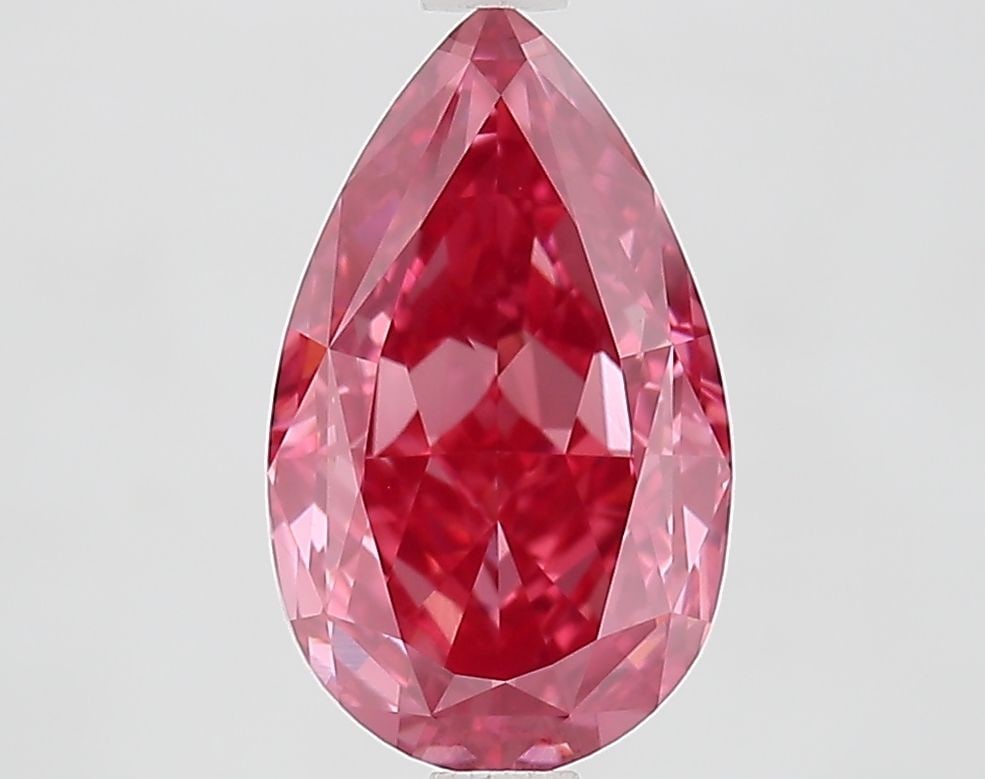 Loose Diamond - PEAR 2.85ct Fancy Vivid Pink VVS2: Loose Diamond - PEAR 2.85ct Fancy Vivid Pink VVS2 Source: This is a real non-mined Diamond that has been grown in a lab Shape: PEAR Carats: 2.85 Color: Fancy Vivid Pink Certification: IGI Video: