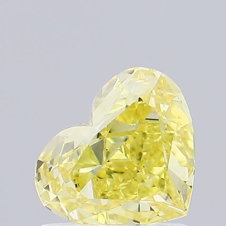 Loose Diamond - HEART 0.81ct Fancy Vivid Yellow VS1: Loose Diamond - HEART 0.81ct Fancy Vivid Yellow VS1 Source: This is a real non-mined Diamond that has been grown in a lab Shape: HEART Carats: 0.81 Color: Fancy Vivid Yellow Certification: IGI Video: