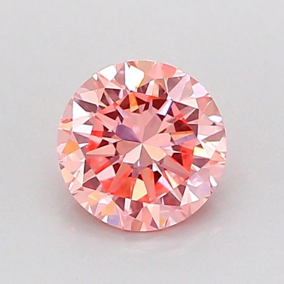 Loose Diamond - ROUND 0.74ct Fancy Vivid Pink VS1: Loose Diamond - ROUND 0.74ct Fancy Vivid Pink VS1 Source: This is a real non-mined Diamond that has been grown in a lab Shape: ROUND Carats: 0.74 Color: Fancy Vivid Pink Certification: IGI Video: