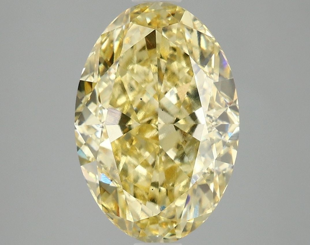 Loose Diamond - OVAL 4.06ct Fancy Vivid Yellow VS2: Loose Diamond - OVAL 4.06ct Fancy Vivid Yellow VS2 Source: This is a real non-mined Diamond that has been grown in a lab Shape: OVAL Carats: 4.06 Color: Fancy Vivid Yellow Certification: IGI Video: