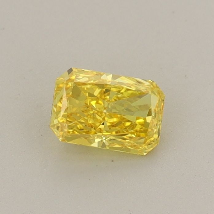Loose Diamond - RADIANT 0.34ct Fancy Vivid Yellow VS1: Loose Diamond - RADIANT 0.34ct Fancy Vivid Yellow VS1 Source: This is a real non-mined Diamond that has been grown in a lab Shape: RADIANT Carats: 0.34 Color: Fancy Vivid Yellow Certification: IGI Vid