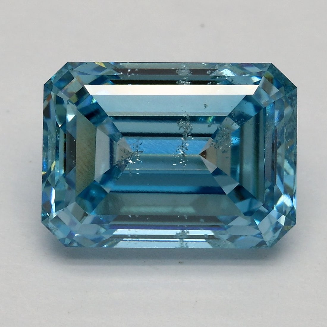 Loose Diamond - EMERALD 5.03ct Fancy Vivid Blue SI2: Loose Diamond - EMERALD 5.03ct Fancy Vivid Blue SI2 Source: This is a real non-mined Diamond that has been grown in a lab Shape: EMERALD Carats: 5.03 Color: Fancy Vivid Blue Certification: IGI Video: