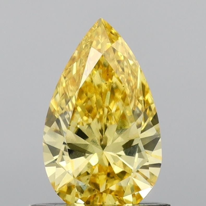 Loose Diamond - PEAR 0.74ct Fancy Vivid Yellow VS2: Loose Diamond - PEAR 0.74ct Fancy Vivid Yellow VS2 Source: This is a real non-mined Diamond that has been grown in a lab Shape: PEAR Carats: 0.74 Color: Fancy Vivid Yellow Certification: IGI Video: