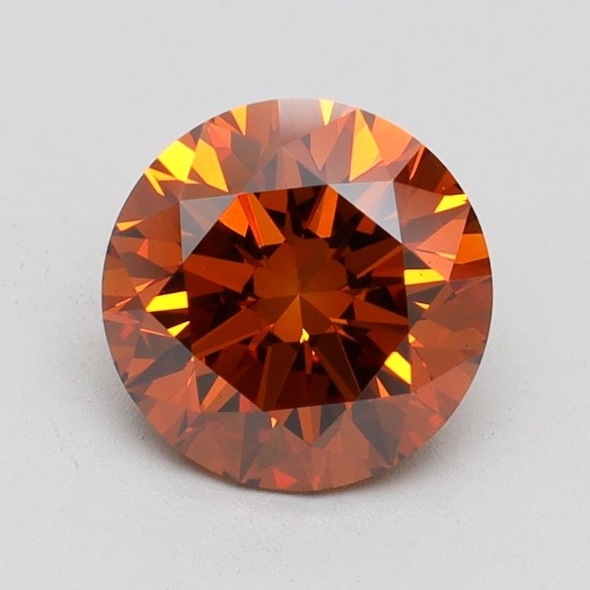 Loose Diamond - ROUND 1.66ct Fancy Vivid Orange VS1: Loose Diamond - ROUND 1.66ct Fancy Vivid Orange VS1 Source: This is a real non-mined Diamond that has been grown in a lab Shape: ROUND Carats: 1.66 Color: Fancy Vivid Orange Certification: IGI Video: