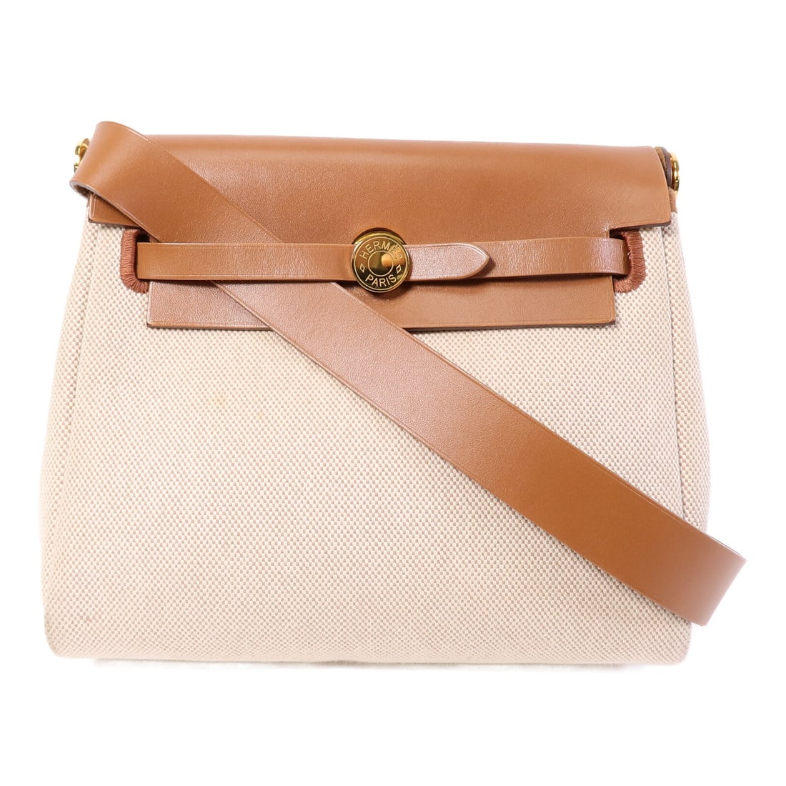 Hermes Mini Herbag Canvas Shoulder Bag Gold Brown: Hermes Mini Herbag Canvas Shoulder Bag Gold Brown Mini Herbag shoulder bag in canvas with a gold and brown color combination. The bag measures approximately 19 cm wide, 17 cm high, and 6 cm deep, with
