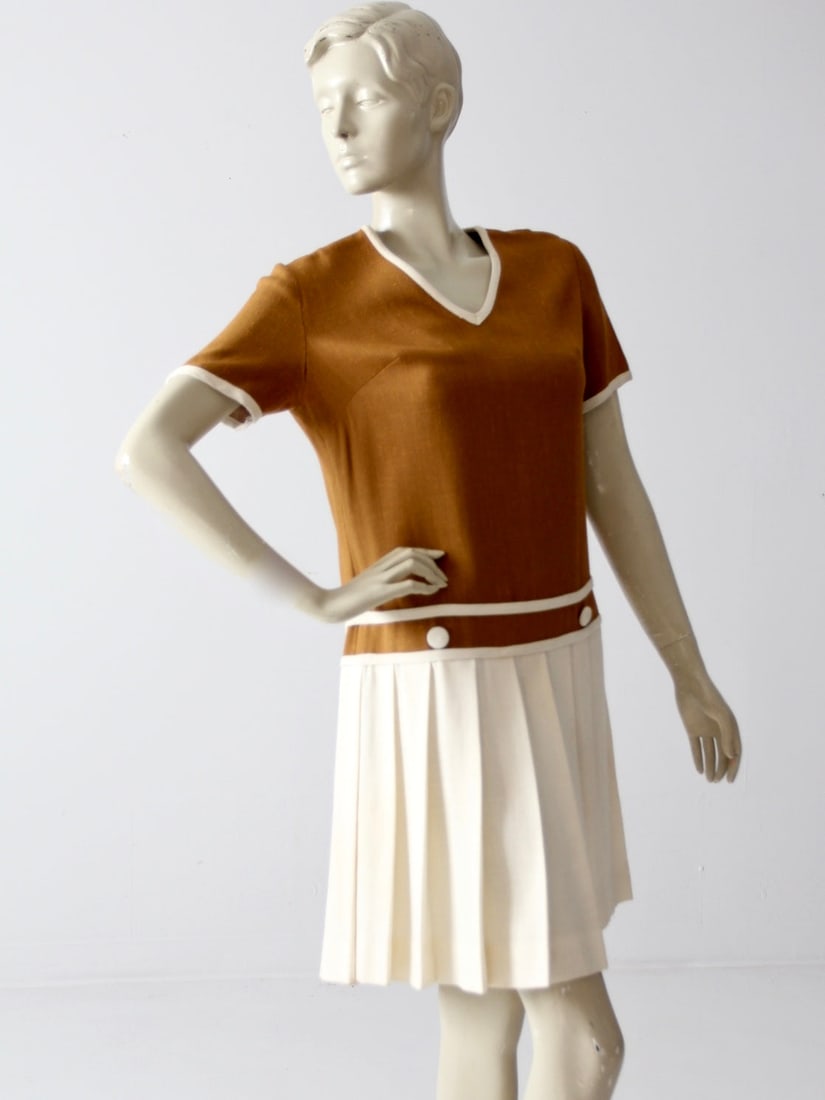 1960s Vintage Bobbie Brooks Wool Blend Drop Waist Dress: 1960s Vintage Bobbie Brooks Wool Blend Drop Waist Dress Step back in time with this charming 1960s vintage Bobbie Brooks drop waist dress. Crafted from a cozy wool blend, this stylish dress features a