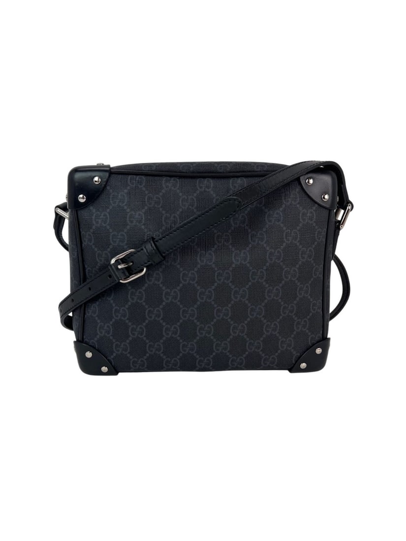 Gucci GG Supreme Black Canvas Messenger Bag with Adjustable Strap: Gucci GG Supreme Black Canvas Messenger Bag with Adjustable Strap Elevate your casual look with the Gucci Black GG Supreme Selleria Square Messenger Bag. This stylish medium-sized messenger bag is cra
